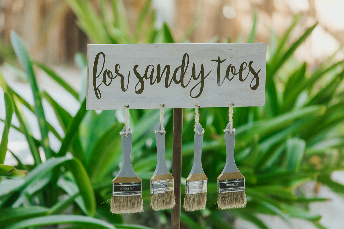 Brushes for sandy toes at Akiin Beach Tulum Wedding in Mexico by Caro Navarro Photography