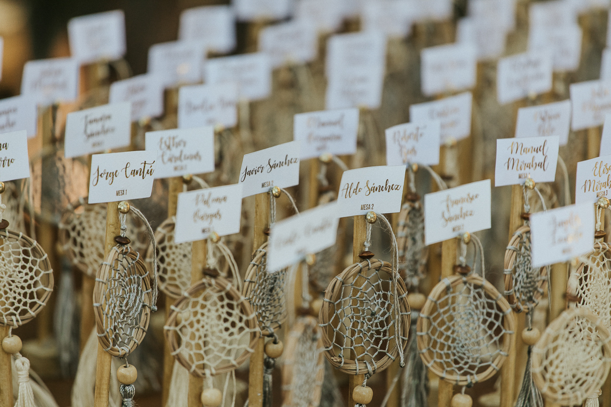 Dream catcher seating cards at Akiin Beach Tulum Wedding in Mexico by Caro Navarro Photography