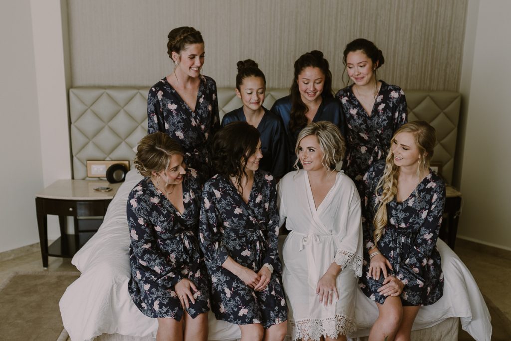 Bridal party in floral robes at Moon Palace Nizuc, Cancun. Caro Navarro Wedding Photography