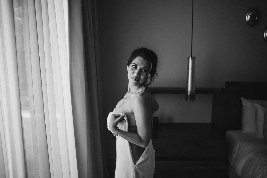 Bride fitting int her wedding dress at Heritage Fairmont Mayakoba by Caro Navarro Photography