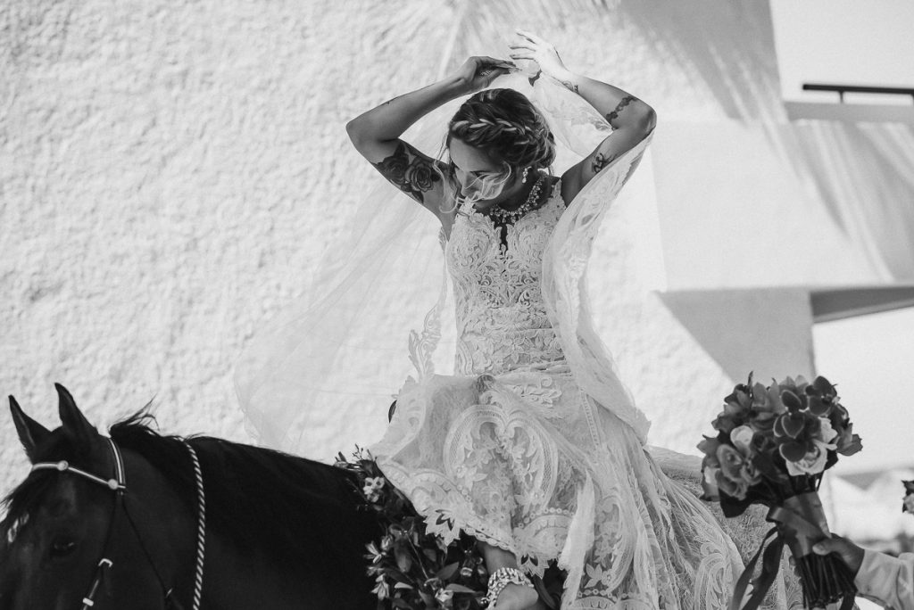 Bride on horse at Now Sapphire Riviera Cancun, Mexico. Caro Navarro Photography