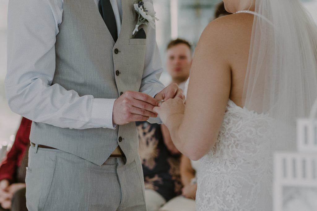 Wedding ring exchange by Caro Navarro Moon Palace Wedding Photography