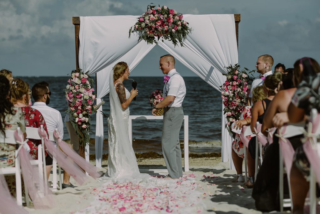 Boho pink and green beach wedding at Now Sapphire Riviera Cancun, Mexico. Caro Navarro Photography