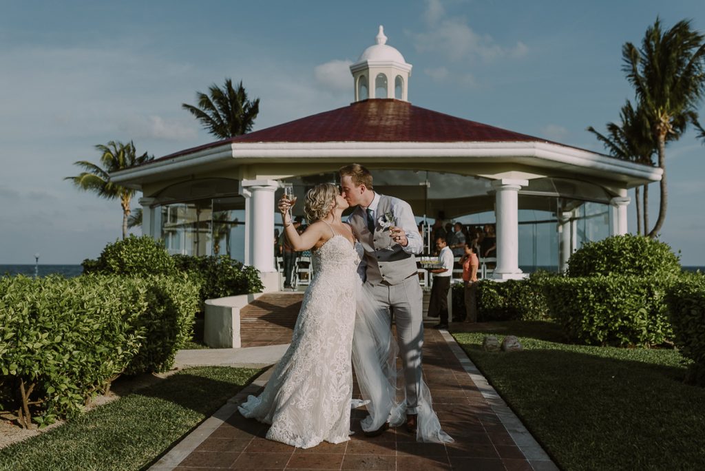 Newlyweds exiting the wedding chapel at Moon Palace Nizuc, Cancun. Caro Navarro Photography