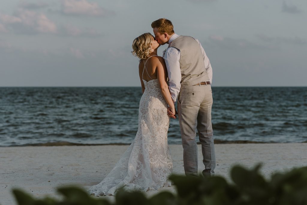 Bride and groom beach portraits at Moon Palace Nizuc. Caro Navarro Photography