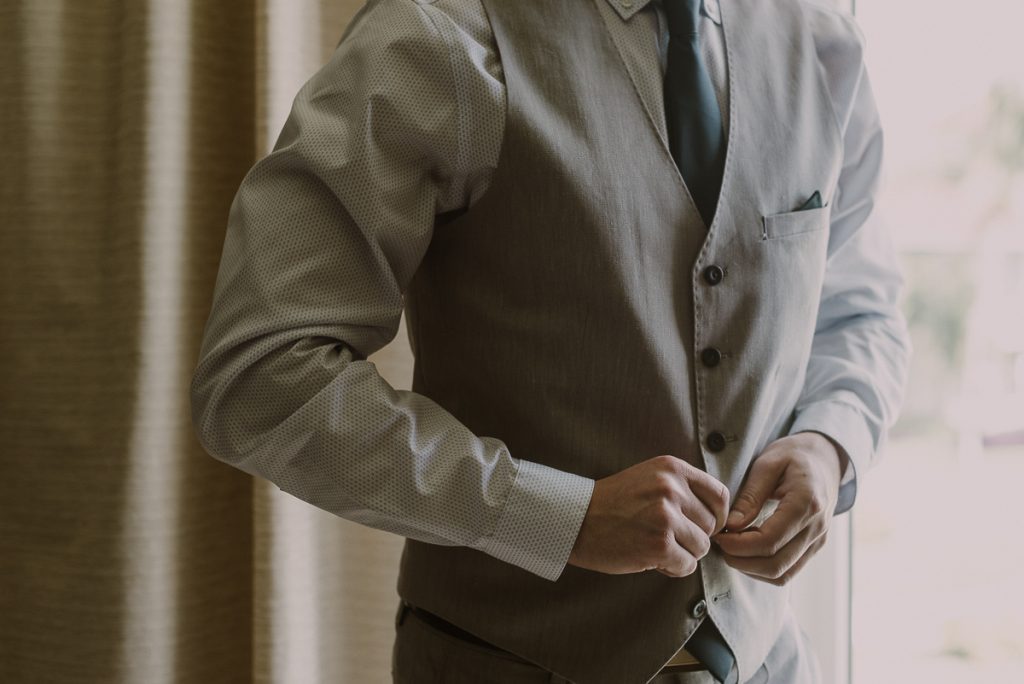 Destination groom in vest. Moon Palace Nizuc Cancun wedding by Caro Navarro Photography