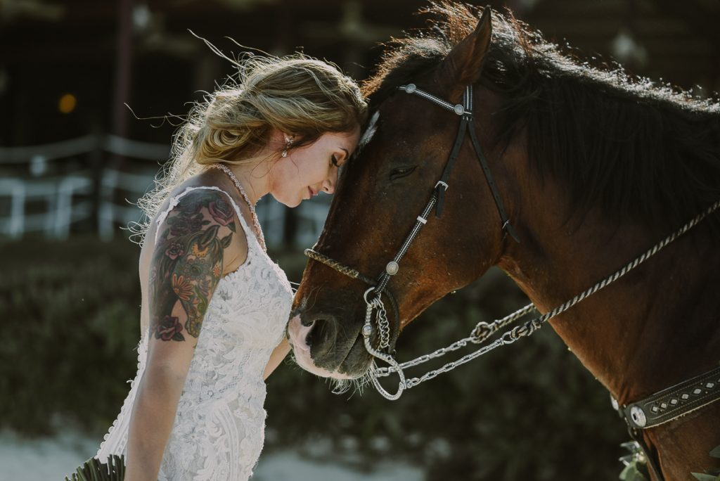 Boho beach bride and horse portraits at Now Sapphire Riviera Cancun, Mexico. Caro Navarro Photography