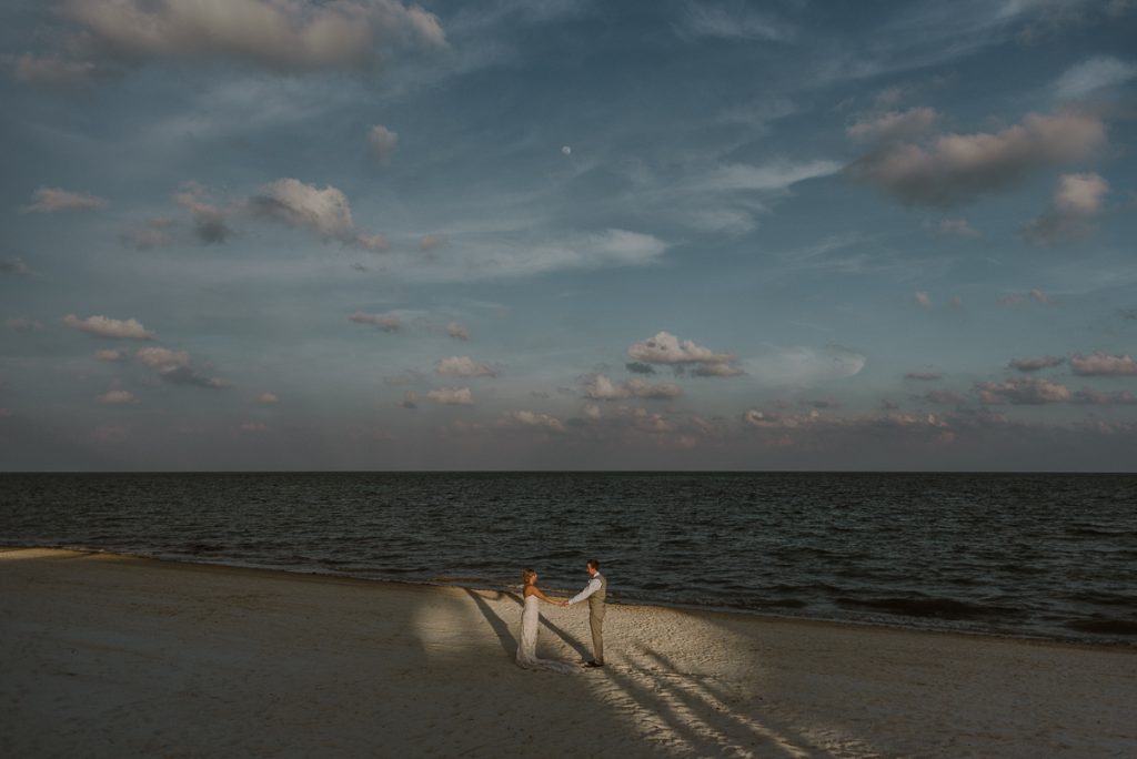 Bride and groom beach portraits at Moon Palace Nizuc. Caro Navarro Cancun Wedding Photography