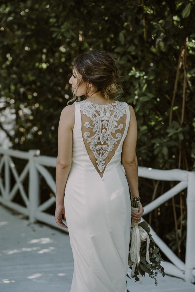 Backless lace wedding dress at Banyan Tree Mayakoba Wedding in Mexico. Caro Navarro Photography