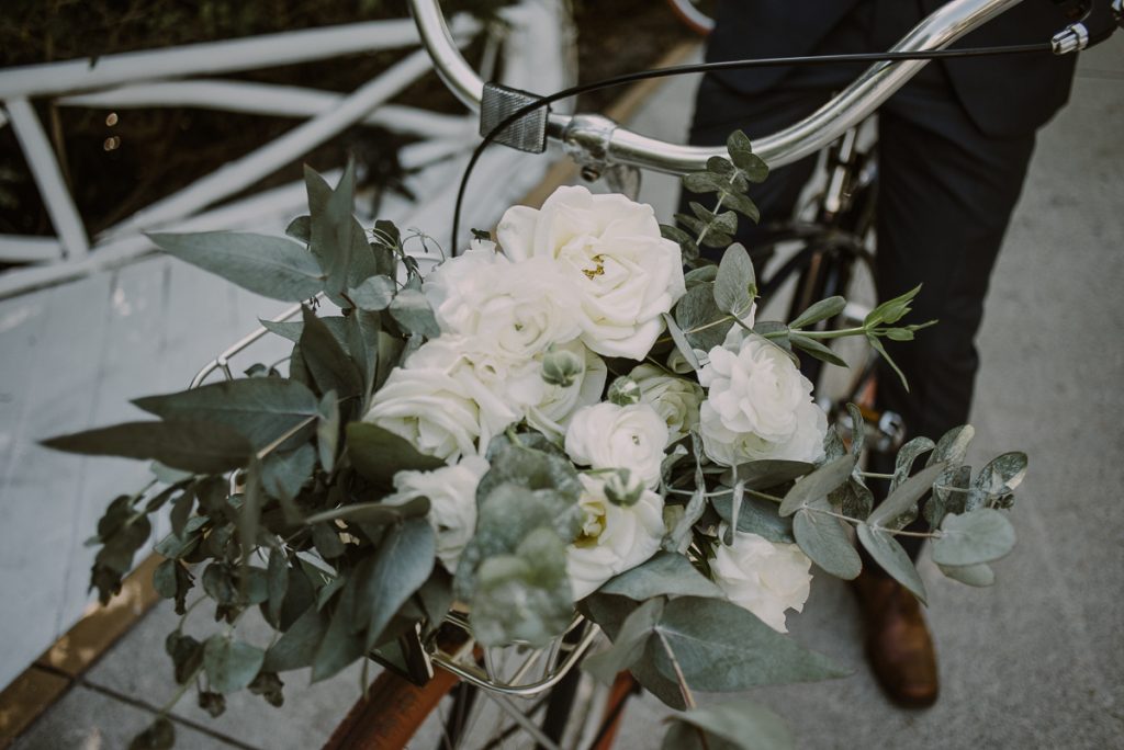 Bridal bouquet on bike at Banyan Tree Mayakoba, Mexico by Caro Navarro Photography