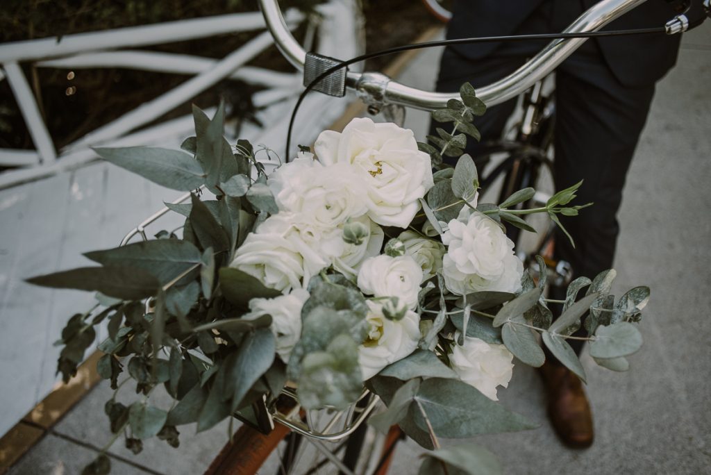 Bridal bouquet on bike at Banyan Tree Mayakoba, Mexico by Caro Navarro Photography