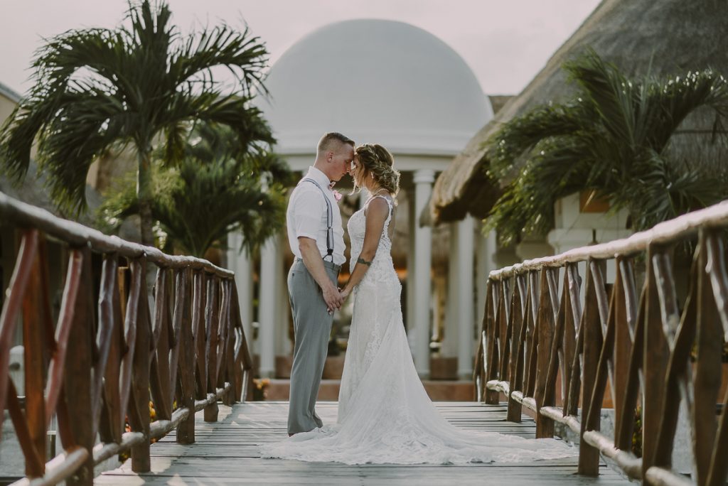 Bride and groom portraits on bridge at Now Sapphire Riviera Cancun, Mexico. Caro Navarro Photography