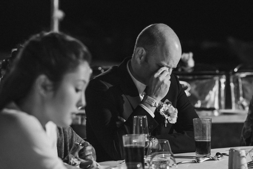 Emotional wedding guests at Moon Palace Nizuc reception. Caro Navarro Photography