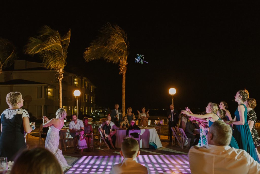 Bouquet toss at Moon Palace Nizuc Cancun Wedding by Caro Navarro Photography