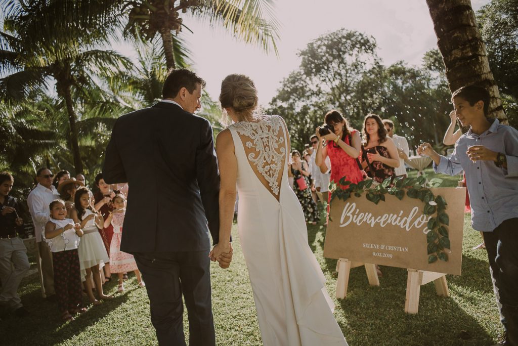 Bride and groom entrance. Playa del Carmen Garden Wedding by Caro Navarro Photography