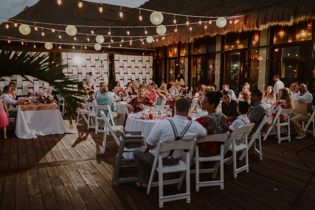 Wedding reception with bistro lights at Now Sapphire Riviera Cancun Tequila Terrace. Caro Navarro Photography