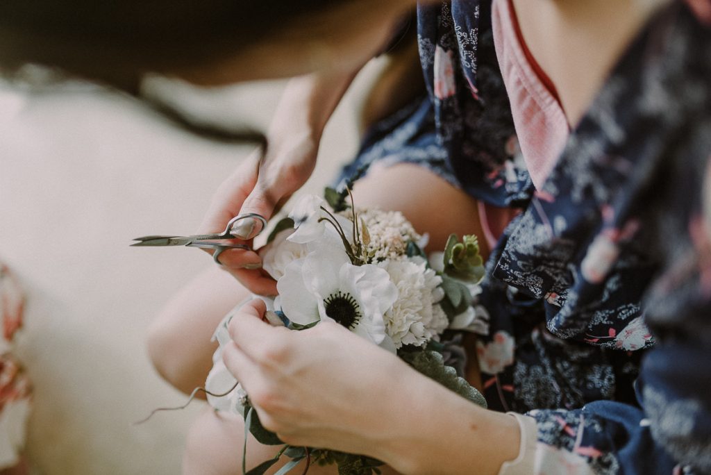 Prepping bridal bouquet at Moon Palace Resort, Cancun, Mexico. Caro Navarro Photography