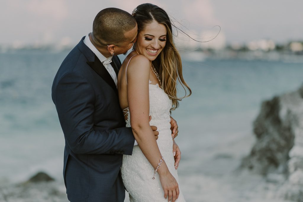Bride and groom beach portraits. Riu Caribe Cancun destination wedding by Caro Navarro Photography