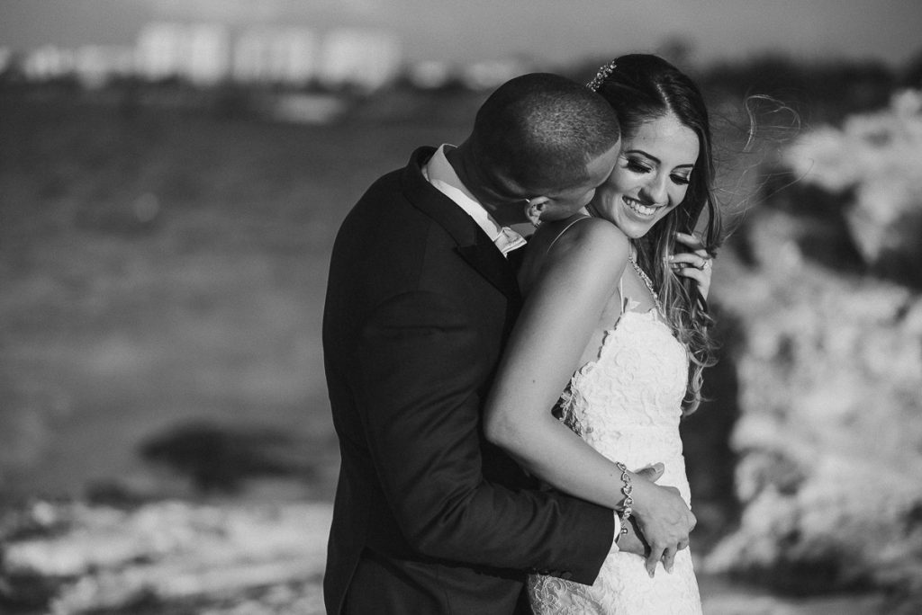 Bride and groom beach portraits. Riu Caribe Cancun destination wedding by Caro Navarro Photography