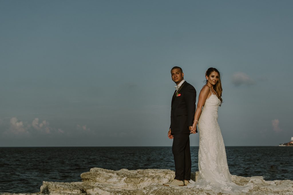 Bride and groom beach portraits. Riu Caribe Cancun destination wedding by Caro Navarro Photography