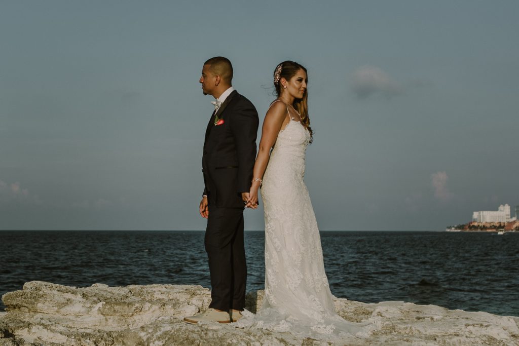Bride and groom beach portraits. Riu Caribe Cancun destination wedding by Caro Navarro Photography