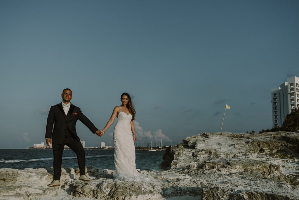 Bride and groom beach portraits. Riu Caribe Cancun destination wedding by Caro Navarro Photography