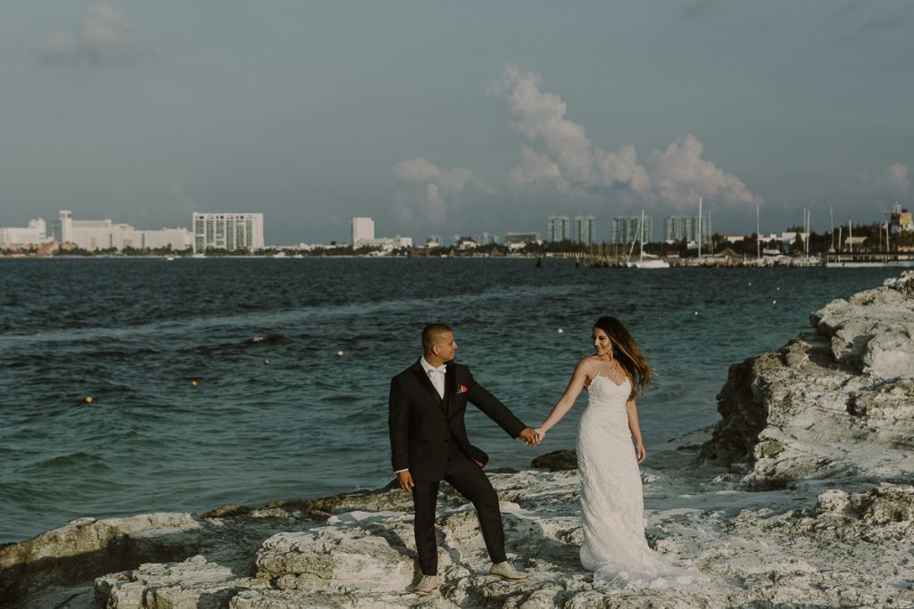 Bride and groom beach portraits. Riu Caribe Cancun destination wedding by Caro Navarro Photography