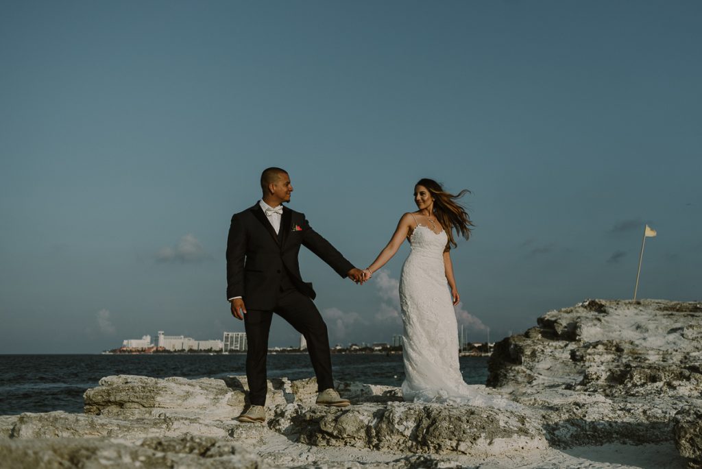 Bride and groom beach portraits. Riu Caribe Cancun destination wedding by Caro Navarro Photography