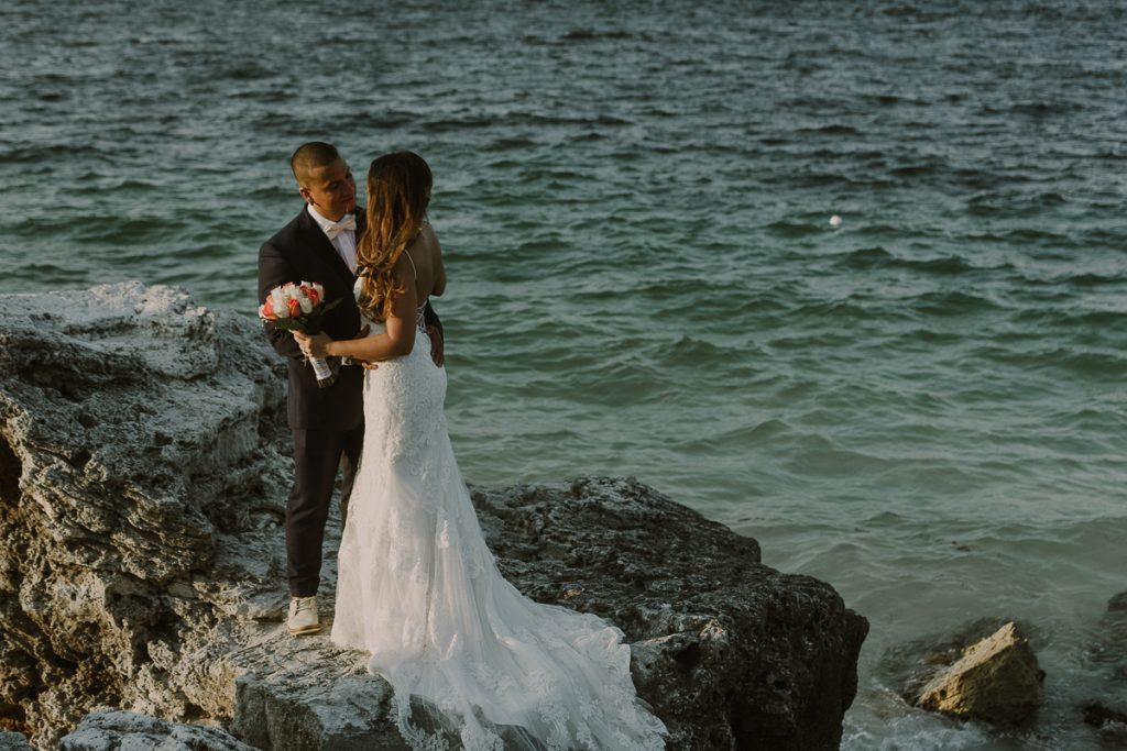 Bride and groom beach portraits. Riu Caribe Cancun destination wedding by Caro Navarro Photography