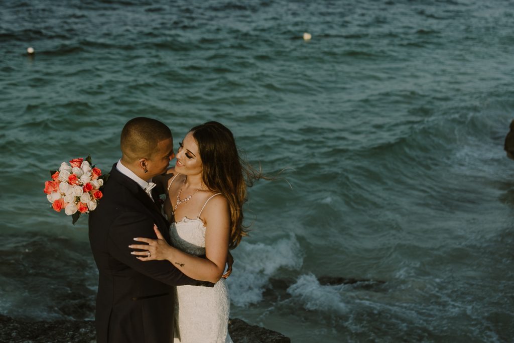 Bride and groom beach portraits. Riu Caribe Cancun destination wedding by Caro Navarro Photography