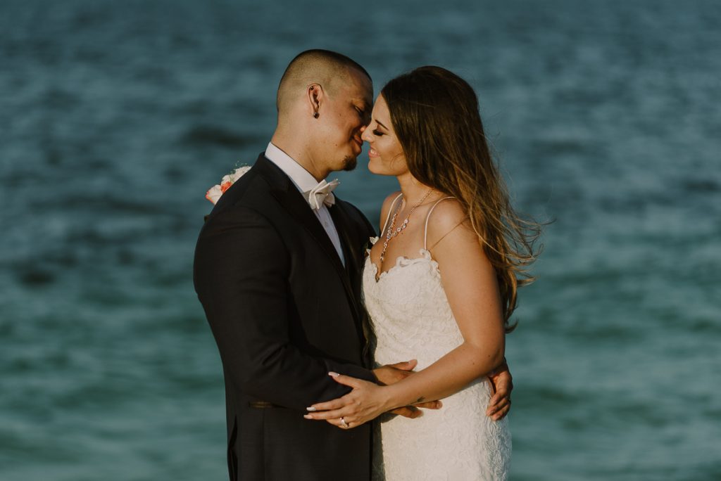 Bride and groom beach portraits. Riu Cancun destination wedding by Caro Navarro Photography