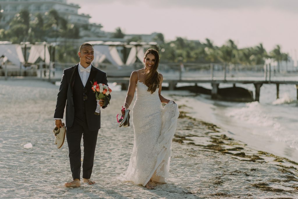 Bride and groom beach portraits. Riu Caribe Cancun destination wedding by Caro Navarro Photography