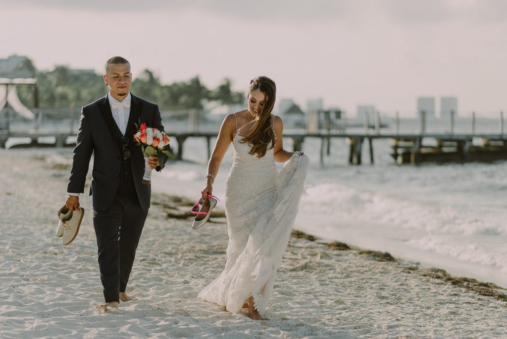 Bride and groom beach portraits. Riu Caribe Cancun destination wedding by Caro Navarro Photography