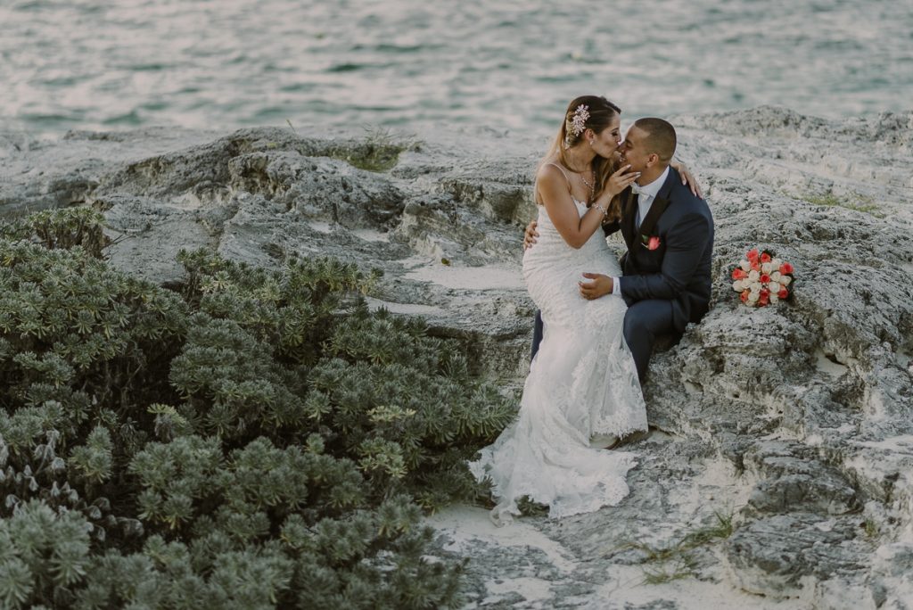 Bride and groom beach portraits. Riu Caribe Cancun destination wedding by Caro Navarro Photography