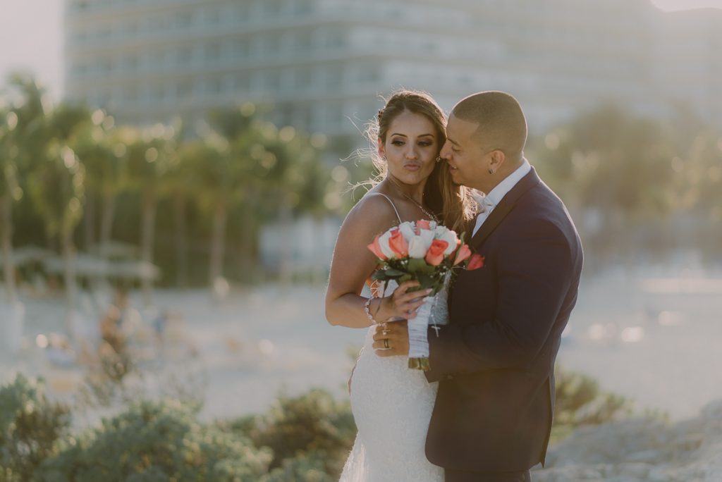 Bride and groom sunset portraits. Riu Caribe Cancun destination wedding by Caro Navarro Photography