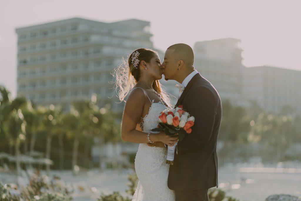 Destination Bride and groom beach portraits. Riu Caribe Cancun wedding by Caro Navarro Photography
