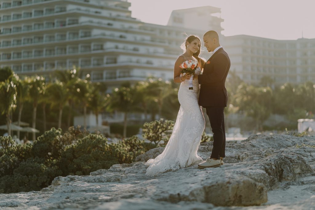 Bride and groom sunset portraits. Riu Caribe Cancun destination wedding by Caro Navarro Photography
