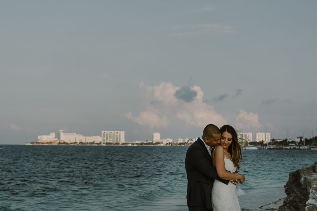 Bride and groom beach portraits. Riu Caribe Cancun destination wedding by Caro Navarro Photography