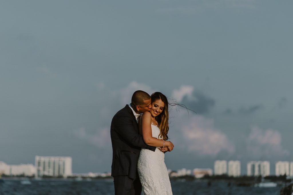 Bride and groom beach portraits. Riu Caribe Cancun destination wedding by Caro Navarro Photography