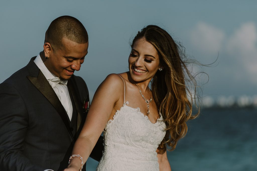 Bride and groom beach portraits. Riu Caribe Cancun destination wedding by Caro Navarro Photography