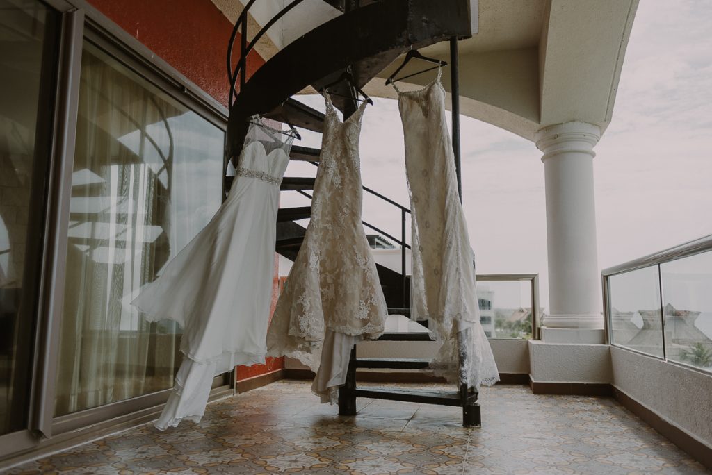 Three wedding dresses ready for a Glam Hard Rock Riviera Maya Destination Wedding in Mexico. Caro Navarro Photography