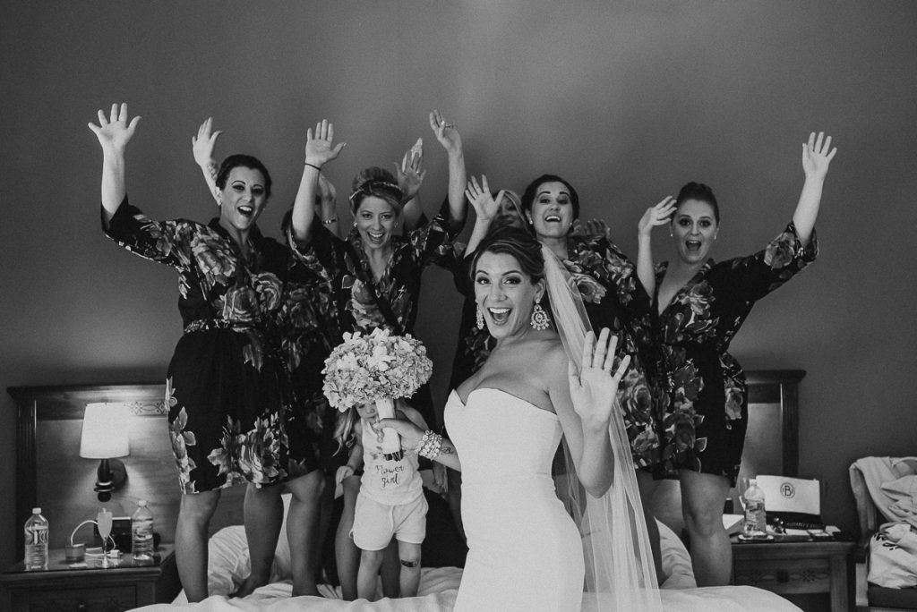 Black and white photo of bride and bridesmaids at Grand Palladium Riviera Maya LGBT Wedding in Mexico. Caro Navarro Photography
