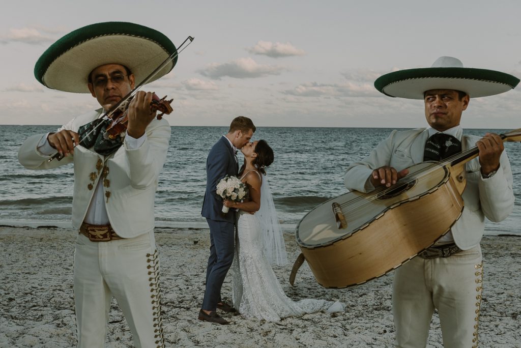 Beach bride and groom with mariachis at Royalton Riviera Cancun wedding. Caro Navarro Photography