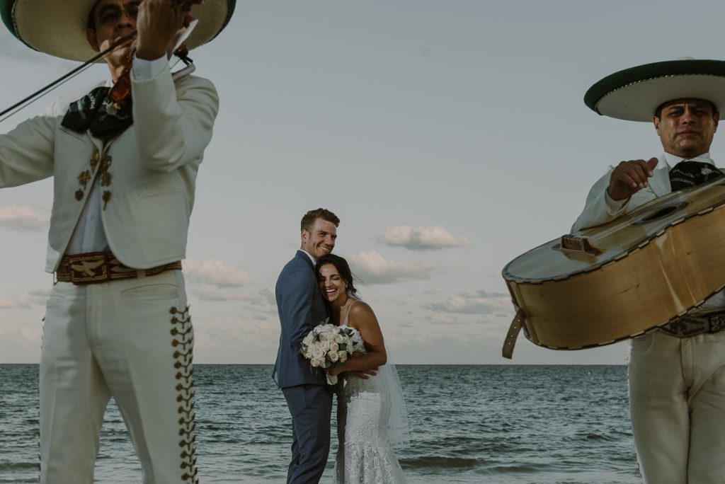 Newlyweds with mariachi. Royalton Riviera Cancun destination wedding by Caro Navarro Photography