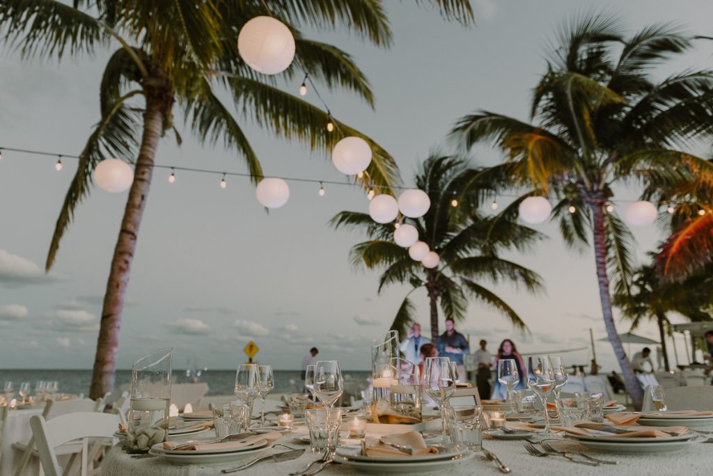 Beach wedding reception with bistro lights. Royalton Riviera Cancun, Mexico. Caro Navarro Photography