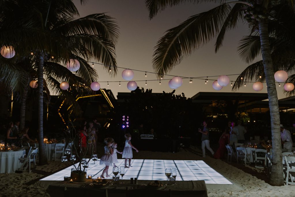 Beach wedding reception with lighted dance floor at Royalton Riviera Cancun, Mexico. Caro Navarro Photography