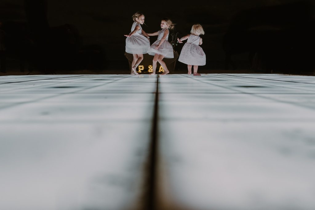 Flower girls dancing at Royalton Riviera Cancun wedding reception, Mexico
