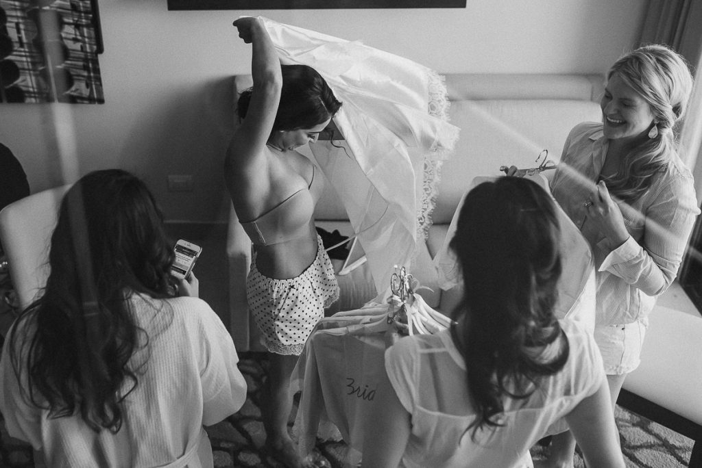 Bride getting into her veil. Royalton Riviera Cancun Wedding by Caro Navarro Photography