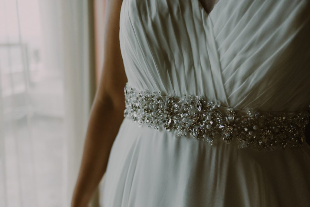 Detail of wedding dress belt at Glam Hard Rock Riviera Maya Destination Wedding, Mexico. Caro Navarro Photography