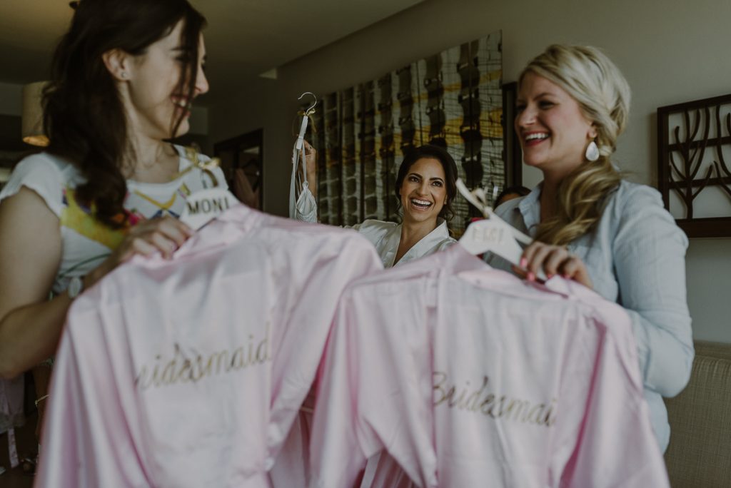 Pink bridesmaids robes and bride at Royalton Riviera Cancun, Mexico. Caro Navarro Photography